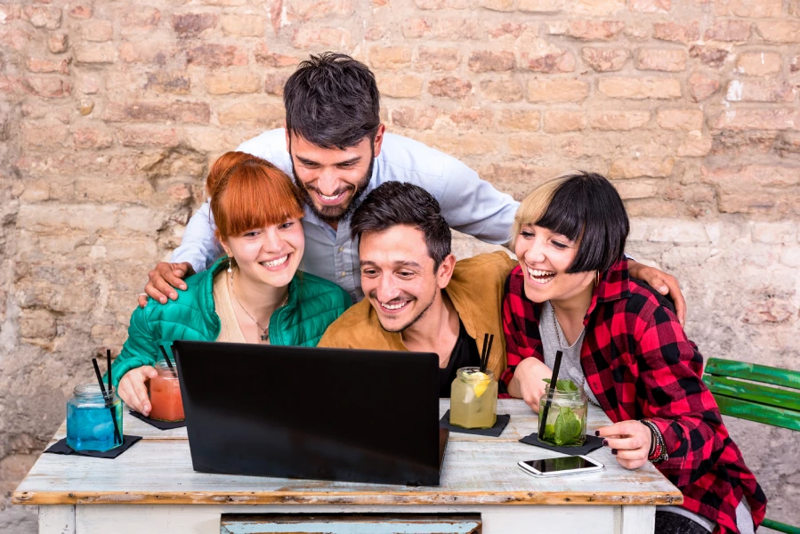 group-of-young-hipster-best-friends-with-computer-2024-07-03-02-44-01-utc